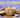 Chocolate chip cookies topped with flaky salt beside a bowl of salt, under the title "Salt in Cookies: Why Bakers Add It and How Much Is Too Much."