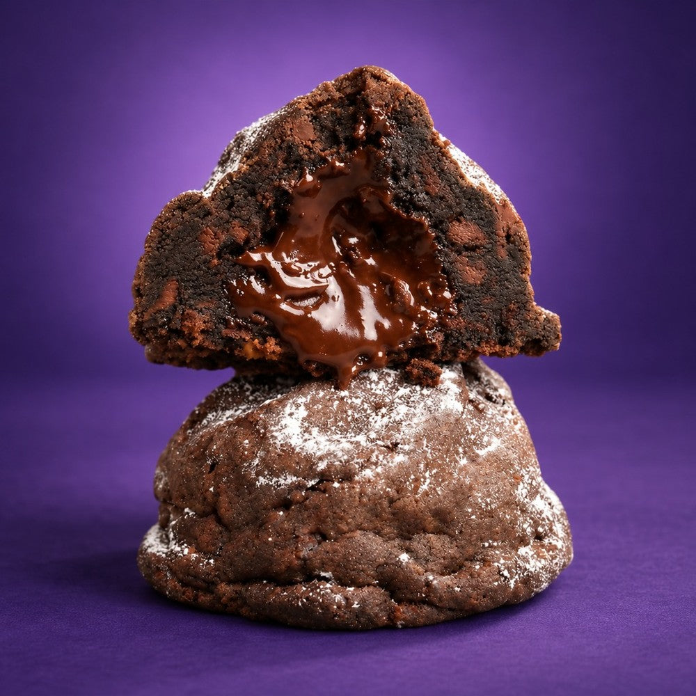 Massive Eruption cookie broken open to show the gooey fudge center